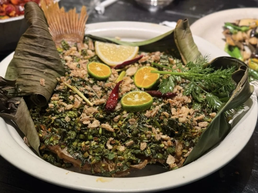 A fish dish topped with herbs, chillies and citrus at Anaago.