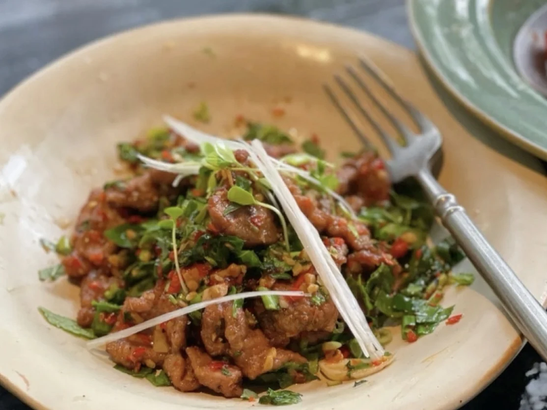 A meat dish with herbs and chillies at Anaago.