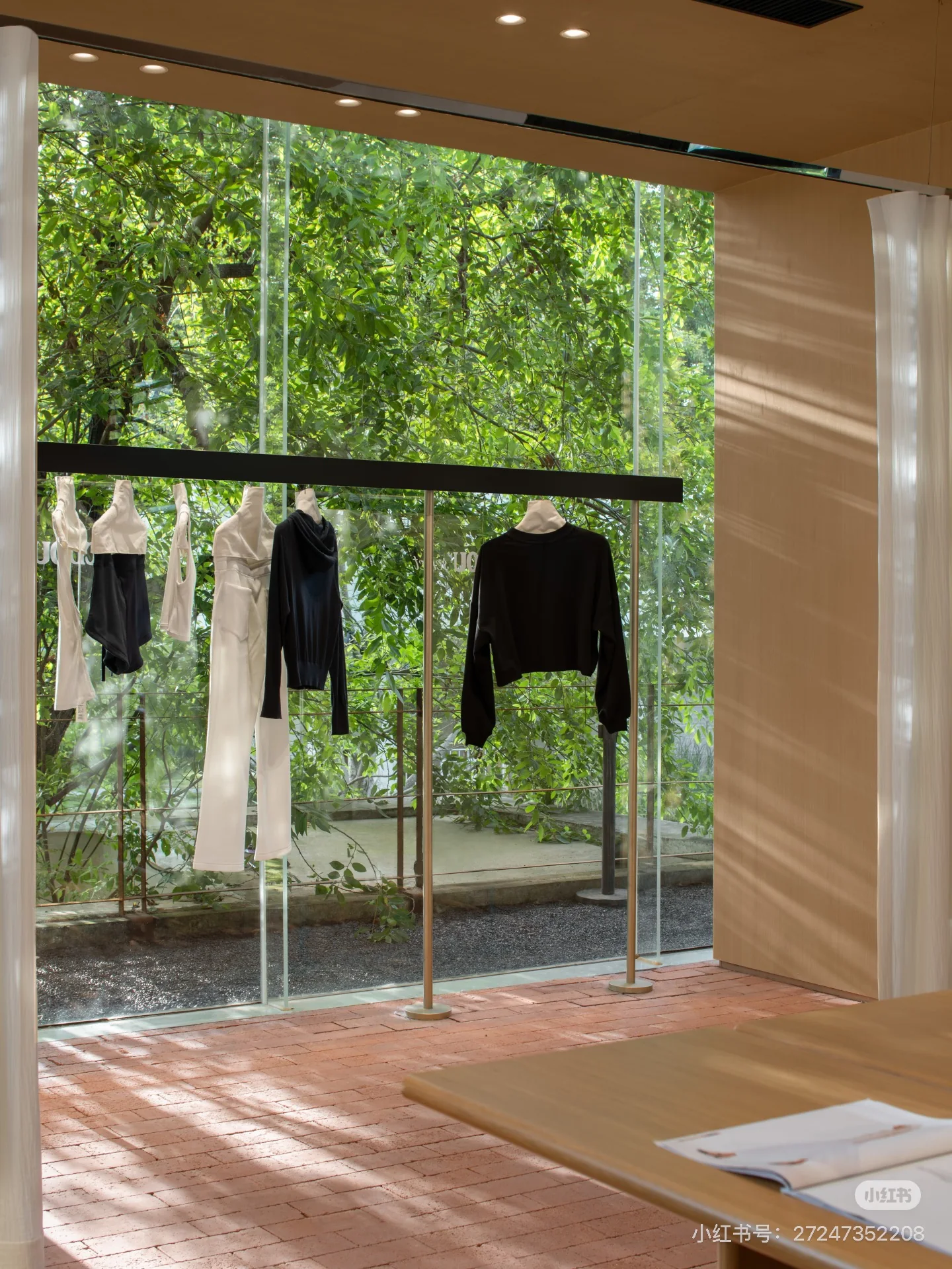 Clothing displayed beside a leafy window inside CDOU select.