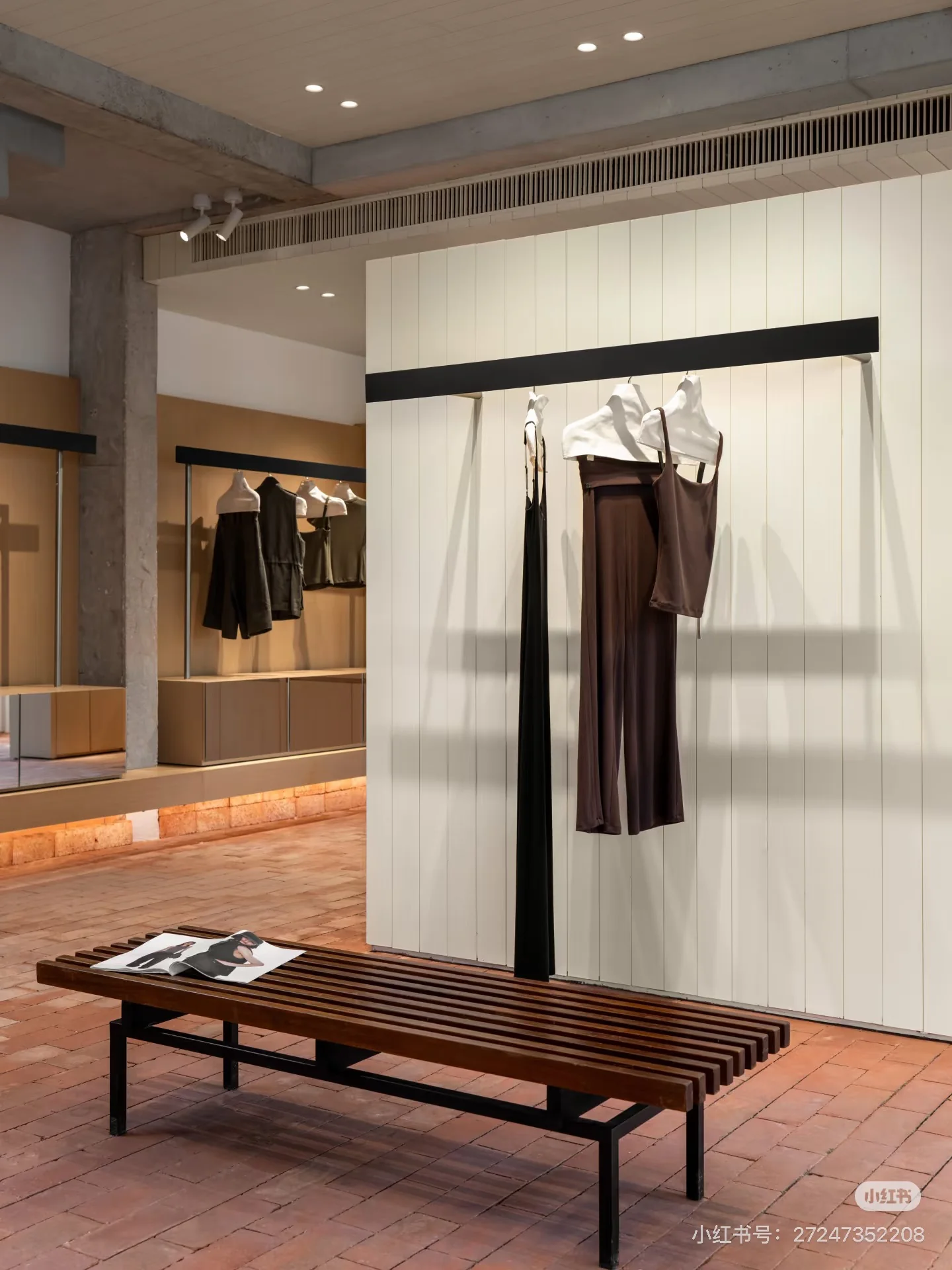 A wooden bench and clothing displays in the CDOU select interior.