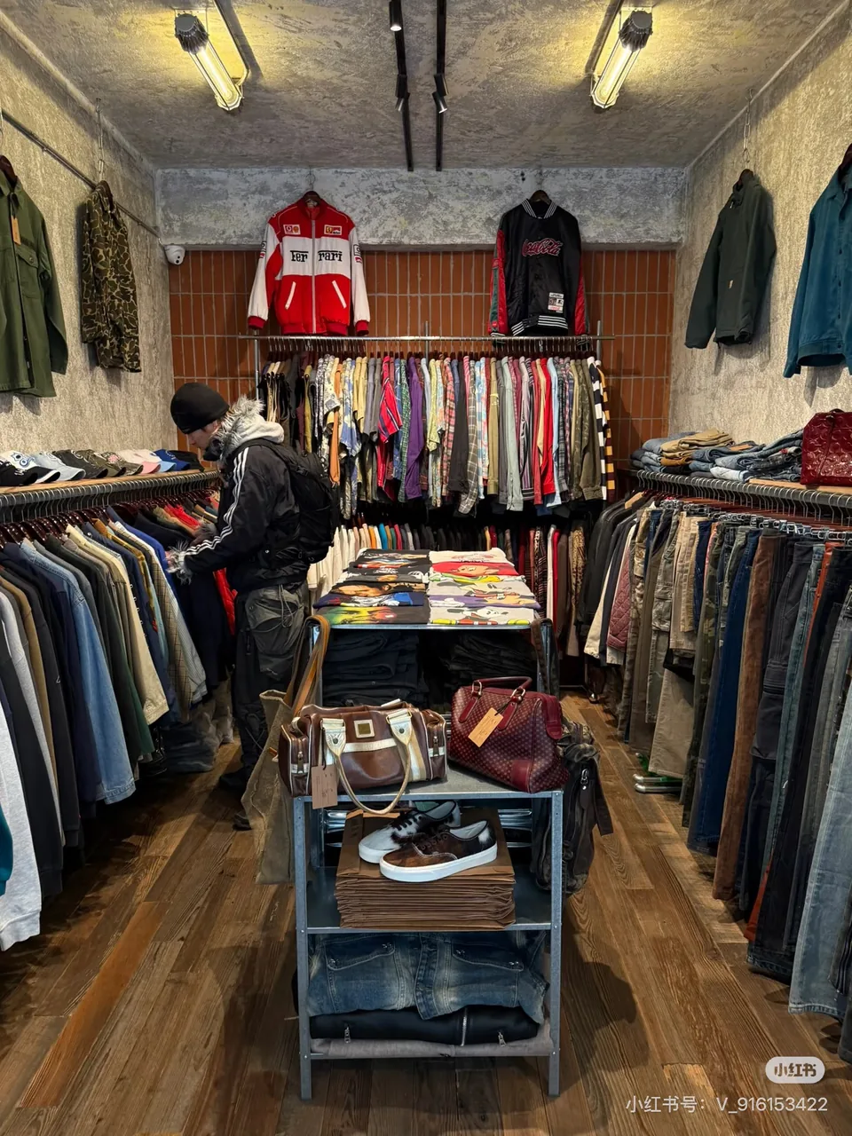 Clothing racks and accessories inside Meursault Union; original RedNote watermark retained